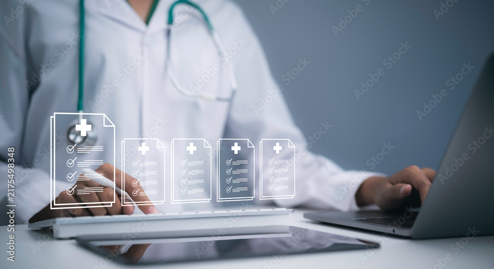Obraz premium Physician using laptop with digital medical records interface showing healthcare documents patient data clinical information electronic health records technology and AI data management system