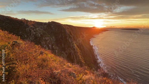 Spectacular sunrise panning over the Waitpinga cliffs and ocean in South Australia in 4k footage