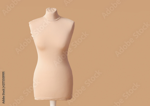 Foto Mannequin for tailor on beige background