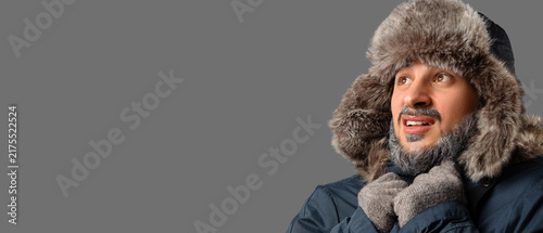 Canvastavla Extreme cold weather and winter survival, man wearing fur hat and parka shiverin
