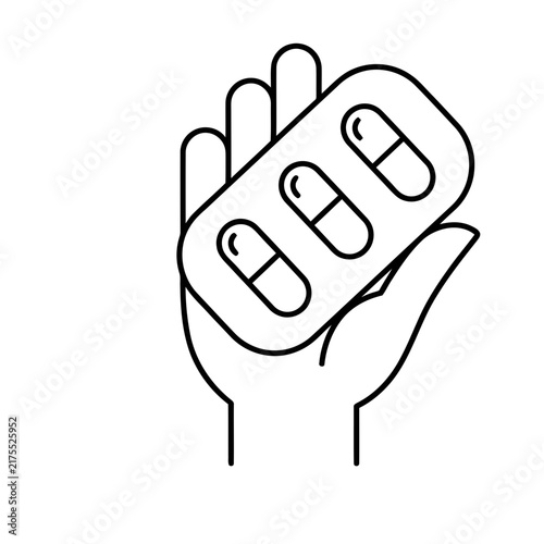 Hand holding blister pack of pills
