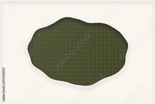 Oval frame cut out from cream paper showing dark olive green grid surface.