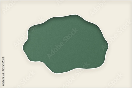 Organic torn paper shape with cutout effect on light beige wall background.