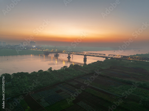 Chuong Duong Bridge over the Red River at Sunrise in Hanoi, Vietnam
