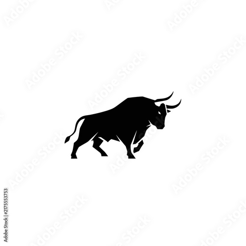 Silhouette of a powerful bull walking