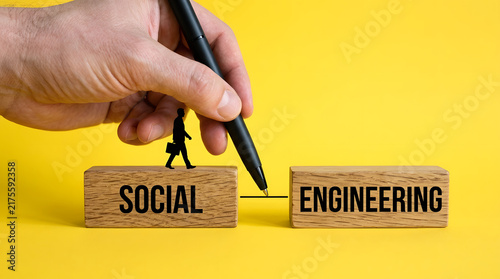 Hand writing social engineering concept with wooden blocks