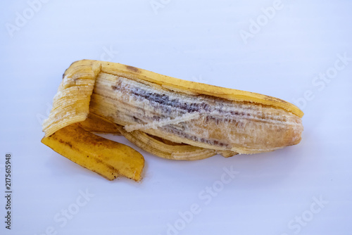 Cuadro en lienzo Rotten peeled banana with dark decaying flesh lying flat