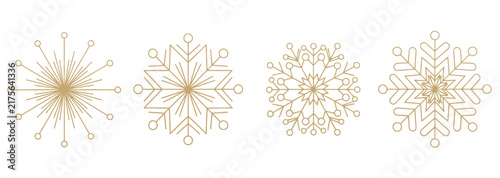 Set of four geometric snowflake crystal icons in golden line art style representing winter seasonal weather and frosty weather patterns for holiday design.