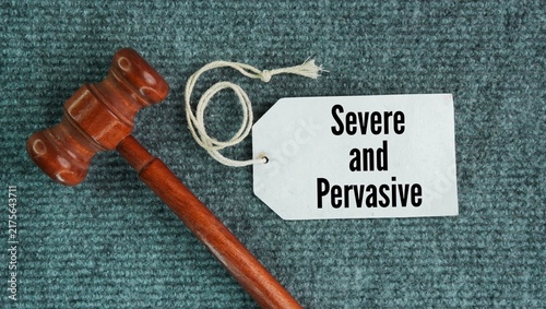 Foto Judge's hammer and paper tags with the words Severe and pervasive is a legal standard used to determine if workplace harassment creates an illegal hostile work environment