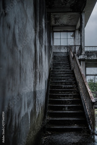 Vertical view of a stairwell in an abandoned Japanese building