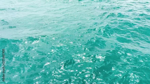Turquoise ripple water reflection in tropical beach. Blue ocean waves. Summer sea. Waves in motion