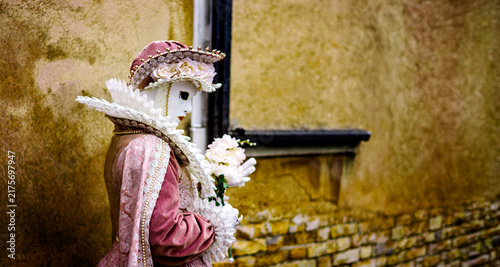 The romantic Colombina mask with a vaporous tulle skirt and a bodice embroidered with floral motifs
