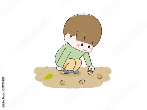 どんぐりを拾うこども