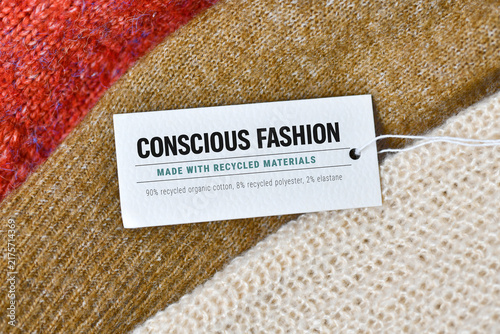 фотографія Clothing label with conscious fashion and made with recycled materials on assort