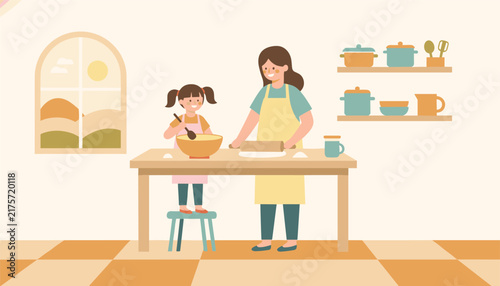 Happy mother and daughter baking together in a cozy kitchen, rolling dough and mixing ingredients on a wooden table.