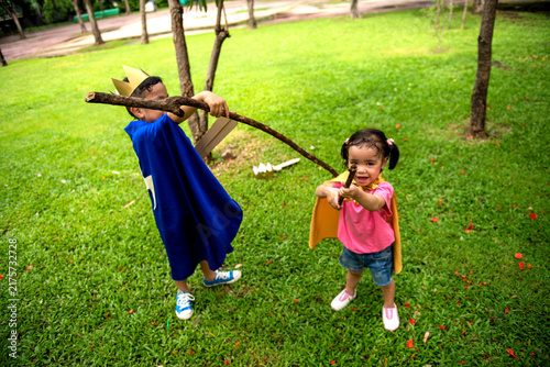 Konstfotografi Children playing with sticks outdoors