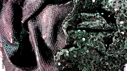 Konstfotografi A close-up shows dark fabric adorned with shiny sequins, capturing details of textures and patterns