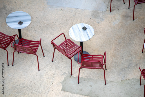 The café's outdoor seating area. Empty tables and chairs. Cafe or restaurant concept. Top view, above, up. No people, nobody. Horizontal photo.