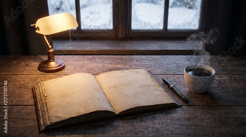 Blank journal and black coffee in pre-dawn light winter morning discipline ritual photo