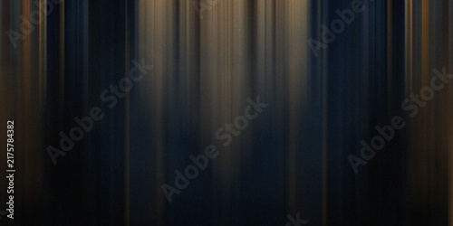 Dark vertical light rays background with golden glow provides dramatic stage effect for luxury product showcase displays.