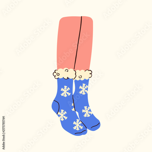 Cozy feet in warm woolen socks relaxing by a fireplace. Winter home comfort, hygge lifestyle, and seasonal relaxation concept. Soft knitted texture, warm aesthetic, and comfortable indoor mood.