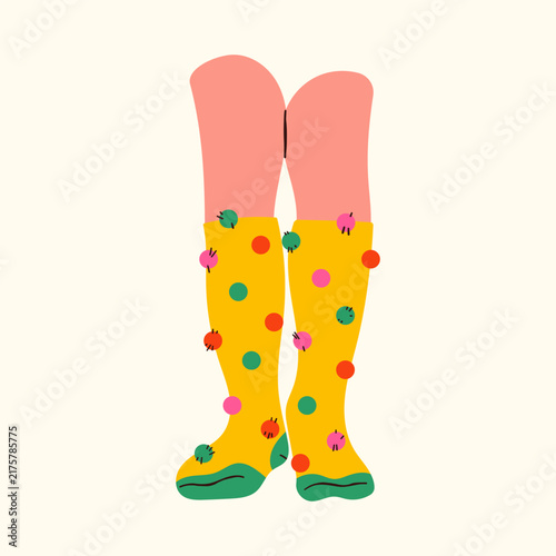 Cozy feet in warm woolen socks relaxing by a fireplace. Winter home comfort, hygge lifestyle, and seasonal relaxation concept. Soft knitted texture, warm aesthetic, and comfortable indoor mood.