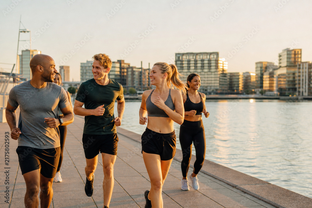 Fototapeta premium Outdoor social running club at sunrise