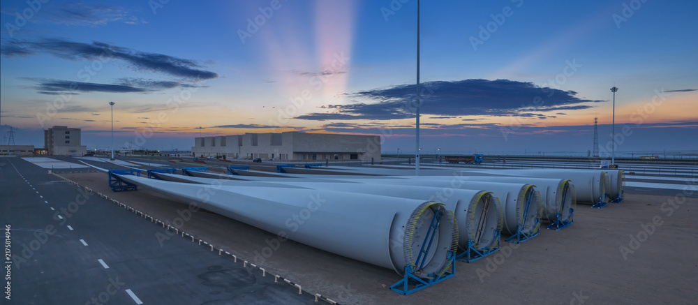 Naklejka premium Wind Turbine Blades Storage Yard At Twilight