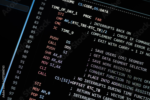 Fototapeta kuchenna Close up of computer programming code on a dark screen, illustrating software development, cybersecurity, data processing, artificial intelligence, coding, algorithms and advanced digital technology.