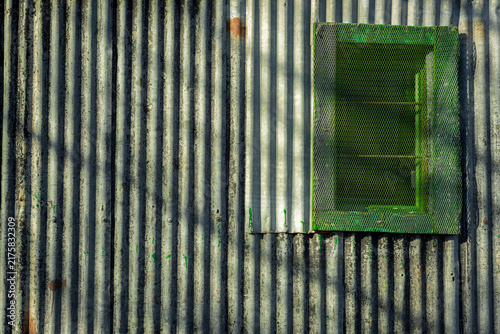 фотографія Colourful corrugated iron barn wall and window