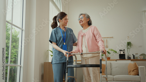 Canvastavla Caregiver nursing home elderly care support senior woman with walker in bright l