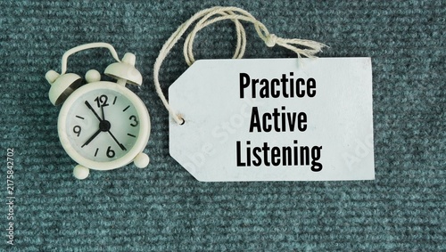 Принти на полотні Chimes and paper tags with the words Practice active listening