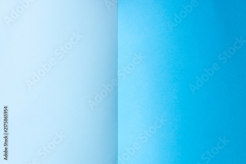 Obraz na plátne A minimalist two-tone paper background with a blue section next to a larger light blue area that shows off a subtle texture