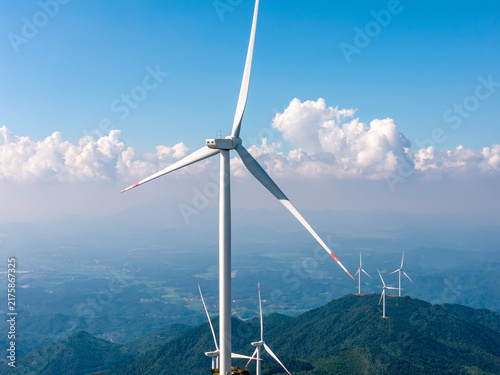 Wind turbines on mountain top, green renewable energy power station