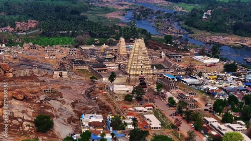 Aerial view of virupaksha temple and hampi market, with tunghabhadra river flowing in background, hampi, karnataka, india.
