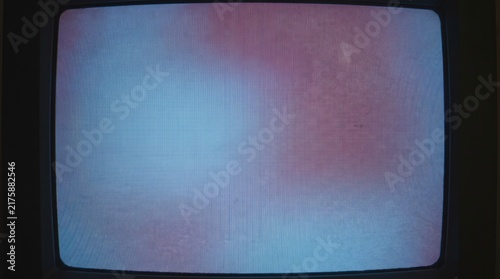 Vintage television screen with abstract red and blue interference patterns