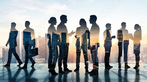 Business Professionals Silhouette Over City Skyline at Sunset - Teamwork Concept
