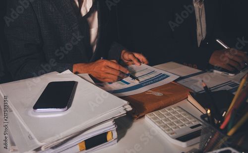 Canvastavla Professional photo of a person's hands reviewing a contract or legal document on