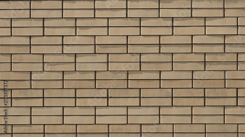 Bild auf Leinwand A smooth, neat wall made of modern beige or light-sand-colored facing brick