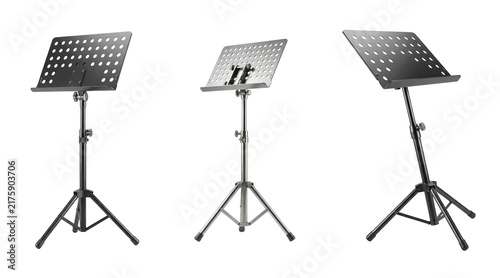 Three music stands with sheet holders on a transparent background