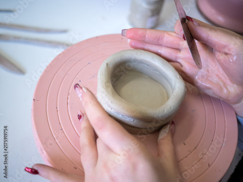 Konstfotografi Close up detail of a person working with raw clay in a cozy pottery studio