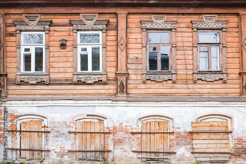 facade of an old wooden and stone house