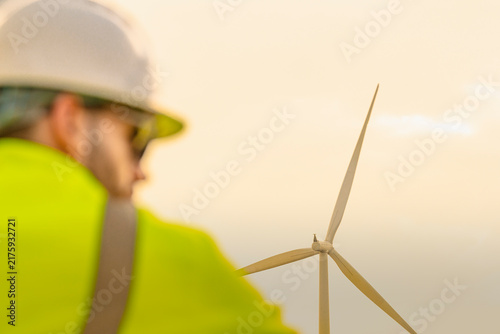 Принти на полотні A three-blade machine spins gently behind the shoulder of a motionless technicia