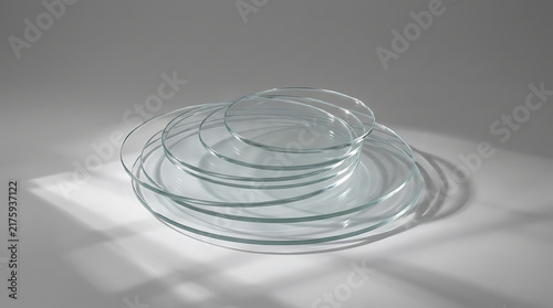 Stack of Petri Dishes: A stack of sterile glass petri dishes arranged in a captivating formation, hinting at scientific exploration and laboratory precision.