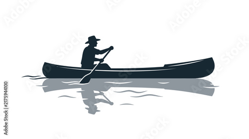 Silhouette of a Person Canoeing on Calm Water with Reflection