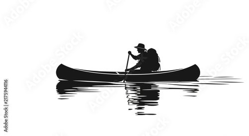 Silhouette of a person canoeing with backpack on calm water, reflection