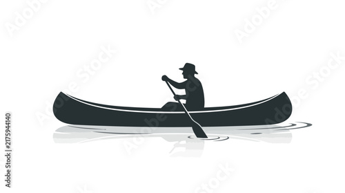 Silhouette of a person in a canoe sailing on water