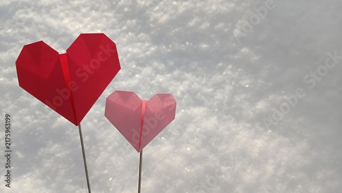 Foto Red and pink origami paper hearts on sticks standing in white snow