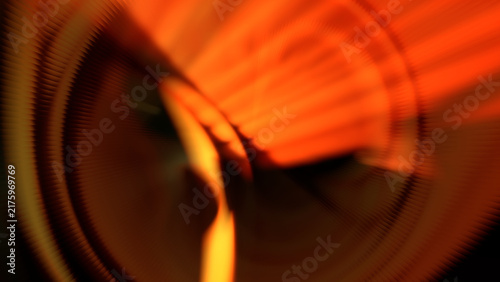 Fiery orange radial spin motion blur abstract background with dynamic glowing tunnel light rays effect