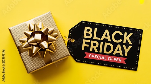 Black friday sale tag with a small silver gift box on a bright yellow background